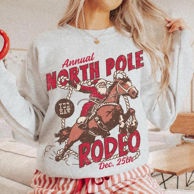 Retro North Pole Rodeo Christmas Sweater, Santa Claus Western Cowboy Christmas Sweatshirt, Vintage Festive Santa Rodeo Hoodie, Dec 25th Crewneck Shirt