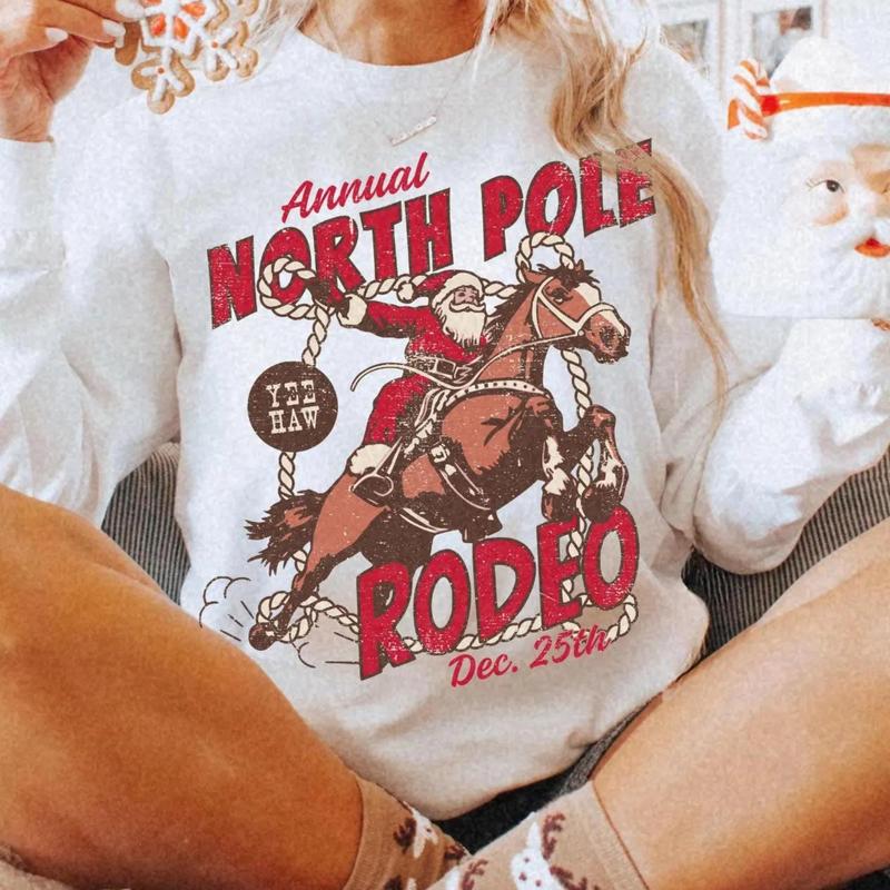 Retro North Pole Rodeo Christmas Sweater, Santa Claus Western Cowboy Christmas Sweatshirt, Vintage Festive Santa Rodeo Hoodie, Dec 25th Crewneck Shirt